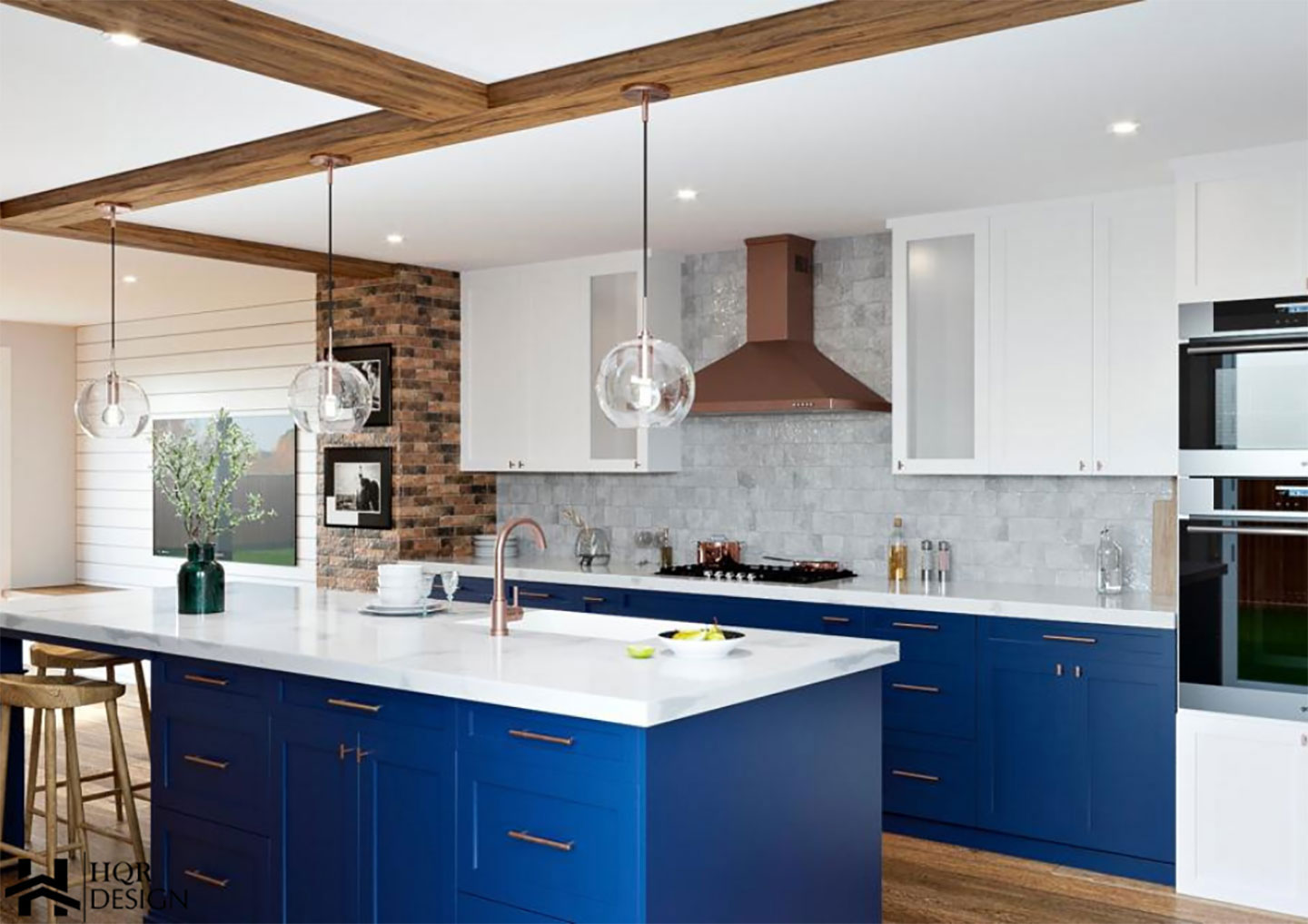 A modern kitchen with blue cabinets, white countertops, and stainless steel appliances.